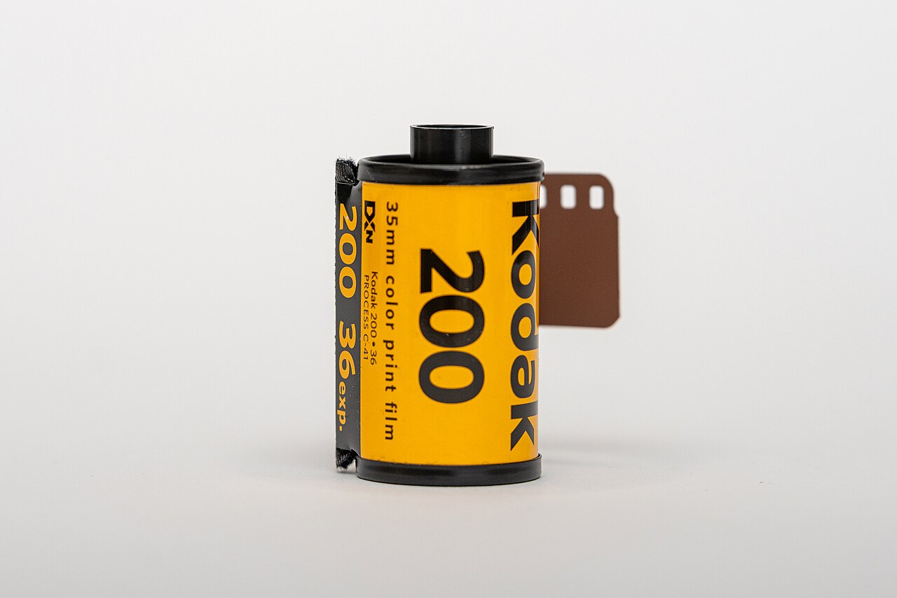Kodak Gold 200 film roll and package beside the Gold 200 versus Portra 400 comparison