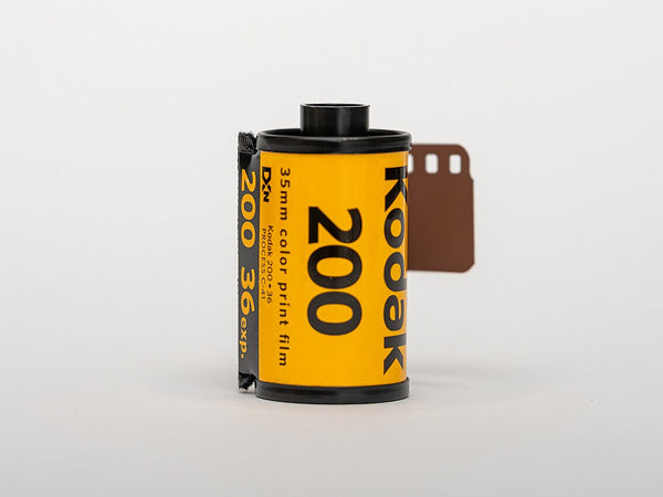 Kodak Gold 200 film roll and package beside the Gold 200 versus Portra 400 comparison