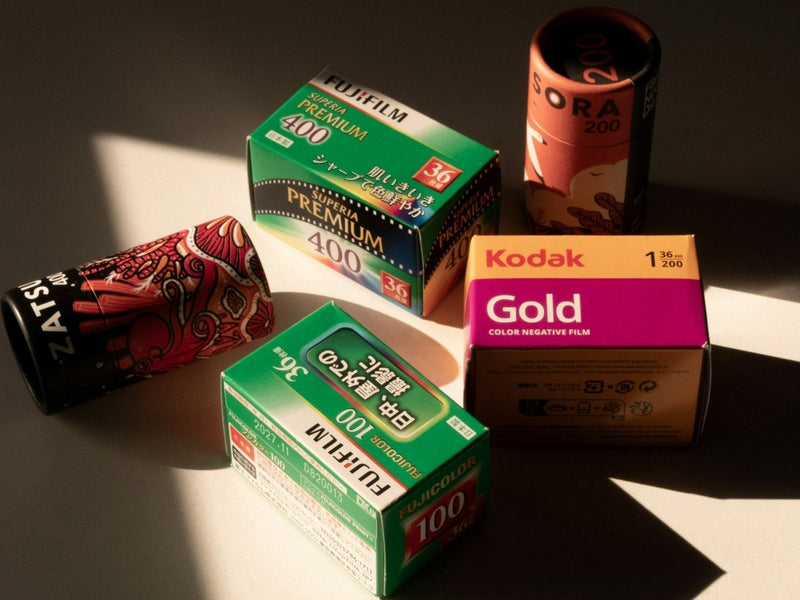 35mm film rolls arranged in warm window light